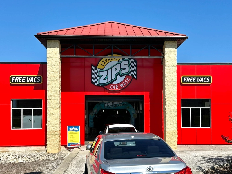 Exterior of the newly renovated red ZIPS Car Wash building on Miller Place in Knoxville, TN