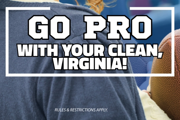 Woman smiling holding a football at a tailgate party. Text reads, "Go Pro with Your Clean! Enjoy $7 off our top two washes. Use code 7700 when you buy in app, Virginia. Rules & restrictions apply.”