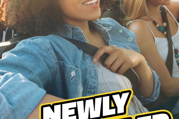 Two women driving in a clean convertible with text that reads "Newly Remodeled in Plainview" and bubble graphic